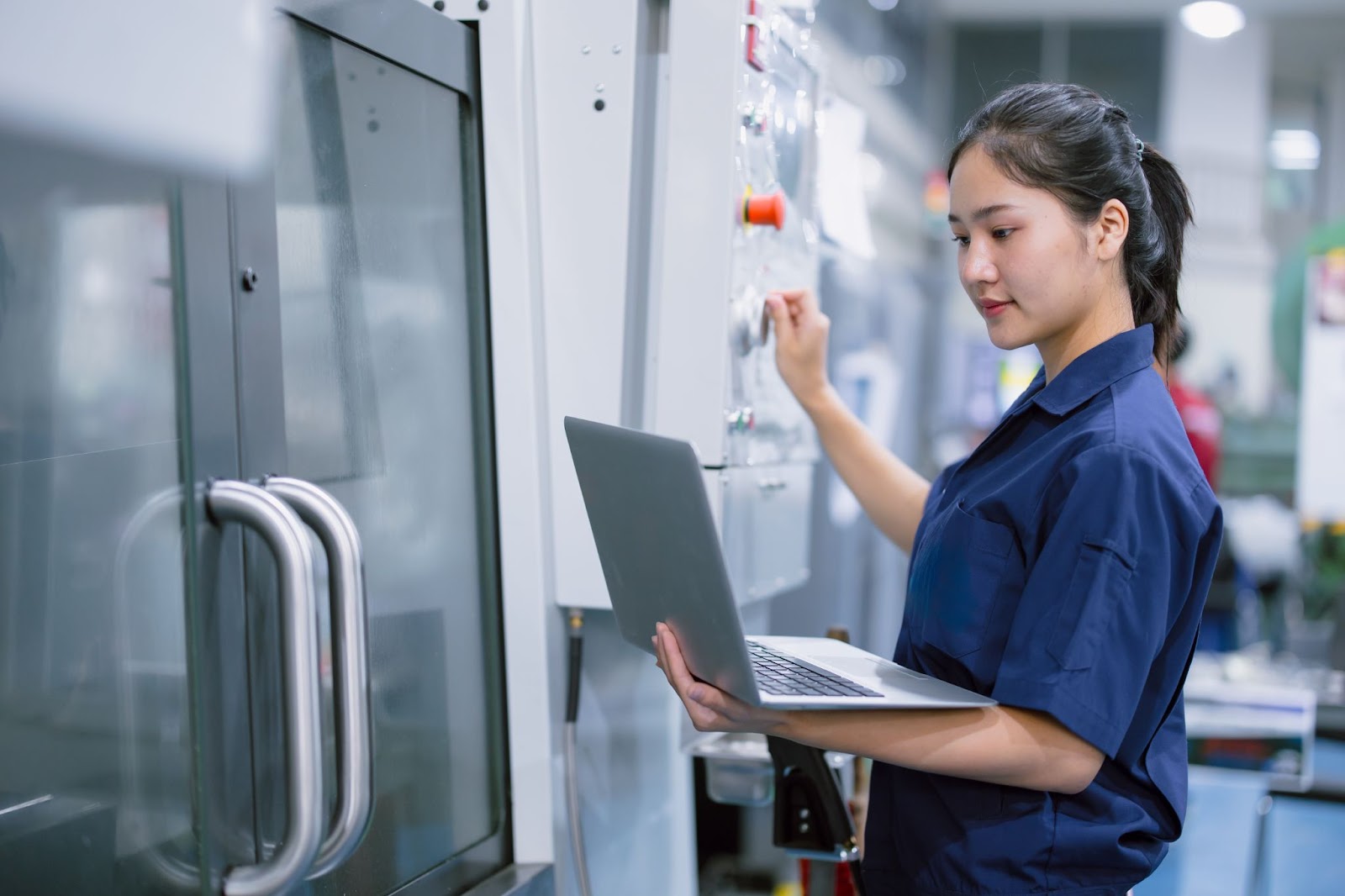 Female worker handling machine start up